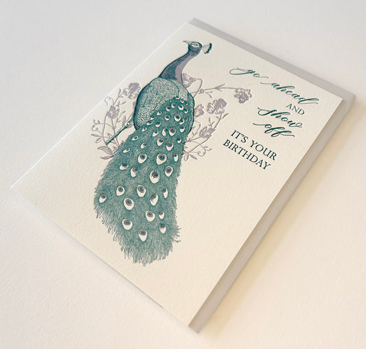 Letterpress birthday card with florals and peacock illustration that reads "Go ahead and show off it's your birthday" by Rust Belt Love
