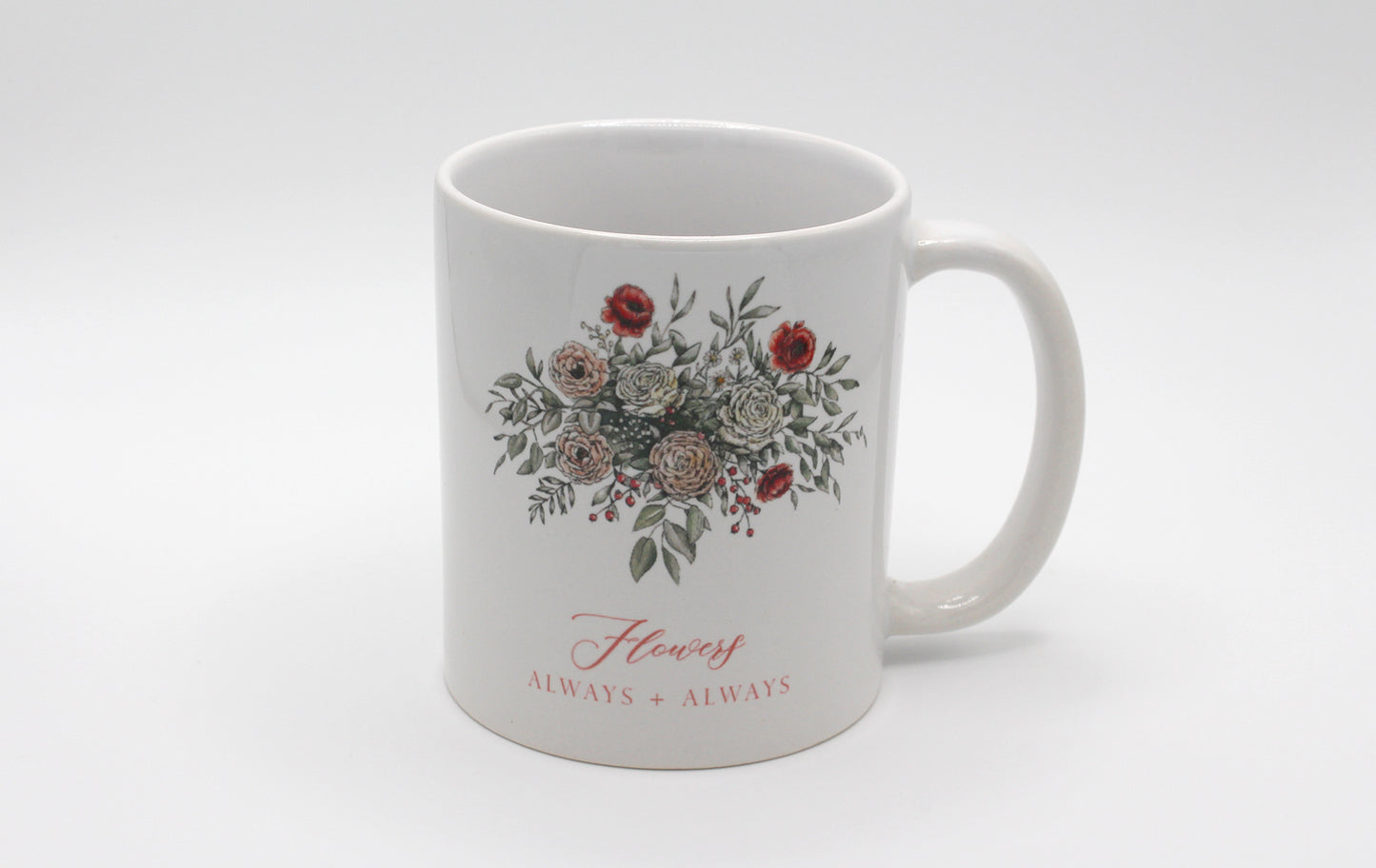 White ceramic mug with floral illustration and the words Flowers Always + Always