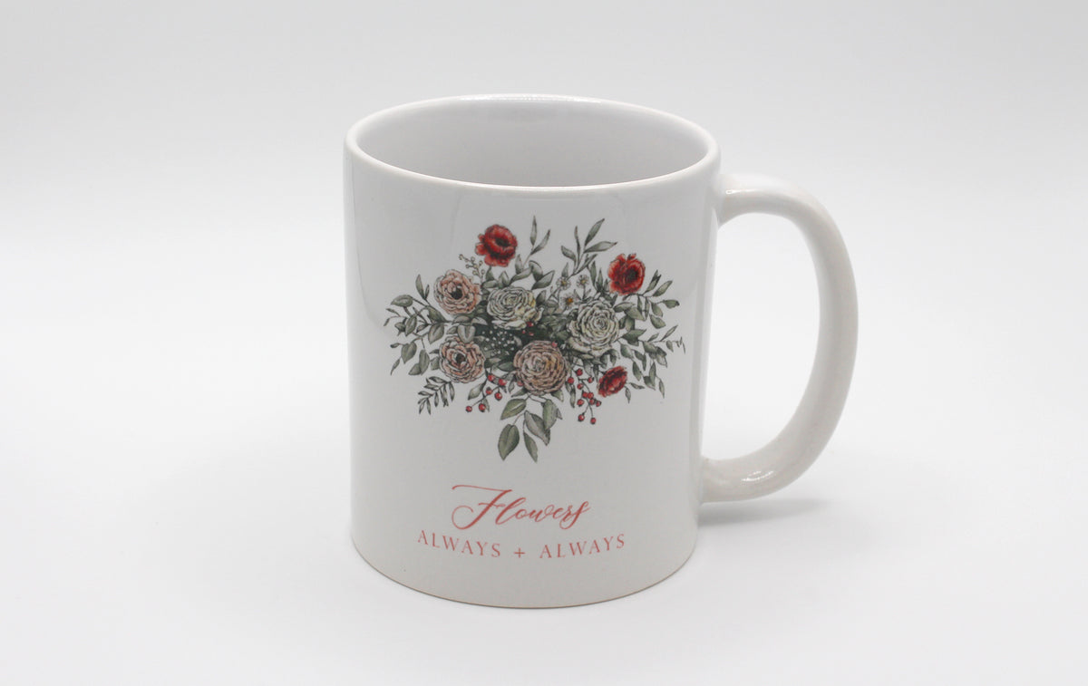 White ceramic mug with floral illustration and the words Flowers Always + Always