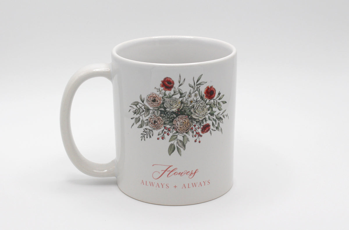 White ceramic mug with floral illustration and the words Flowers Always + Always