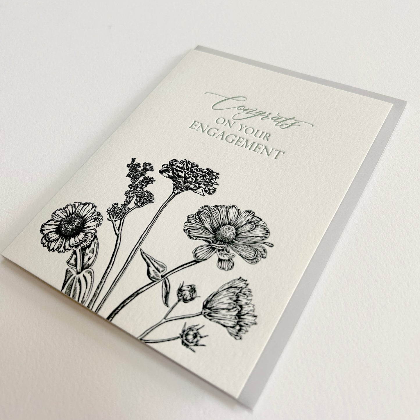 Letterpress congrats card with black florals that says "Congrats on your engagement" by Rust Belt Love