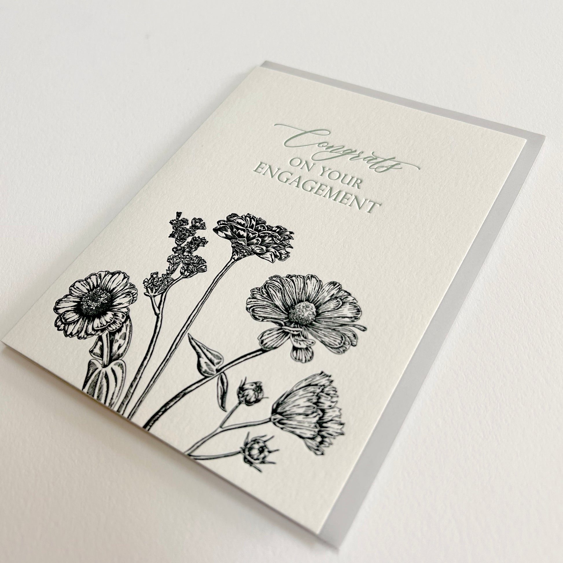 Letterpress congrats card with black florals that says "Congrats on your engagement" by Rust Belt Love
