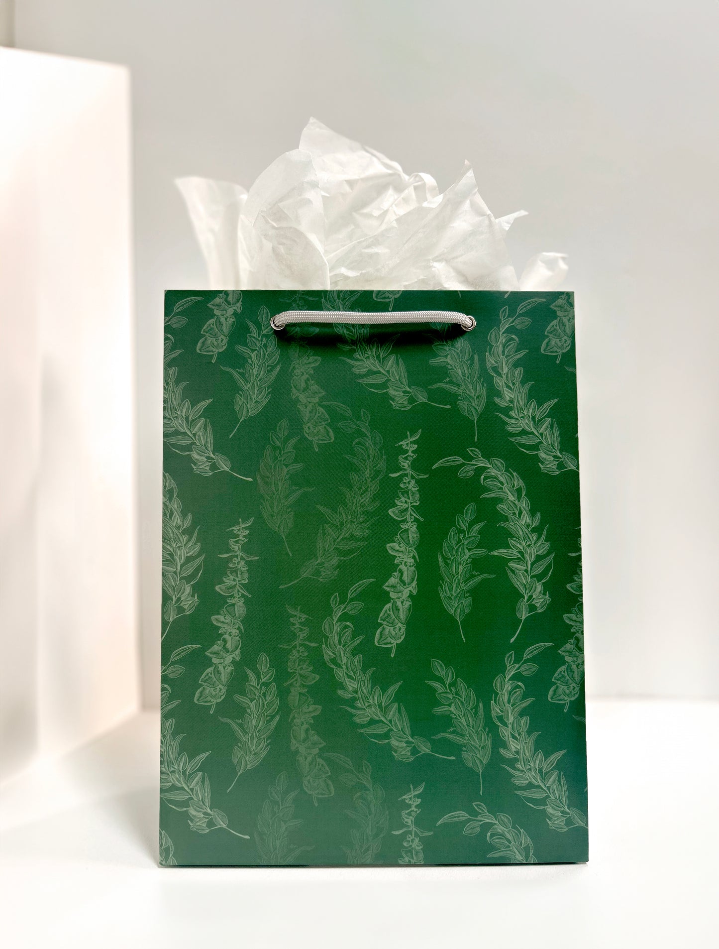 Standing picture of green gift bag with eucalyptus print by Rust Belt Love