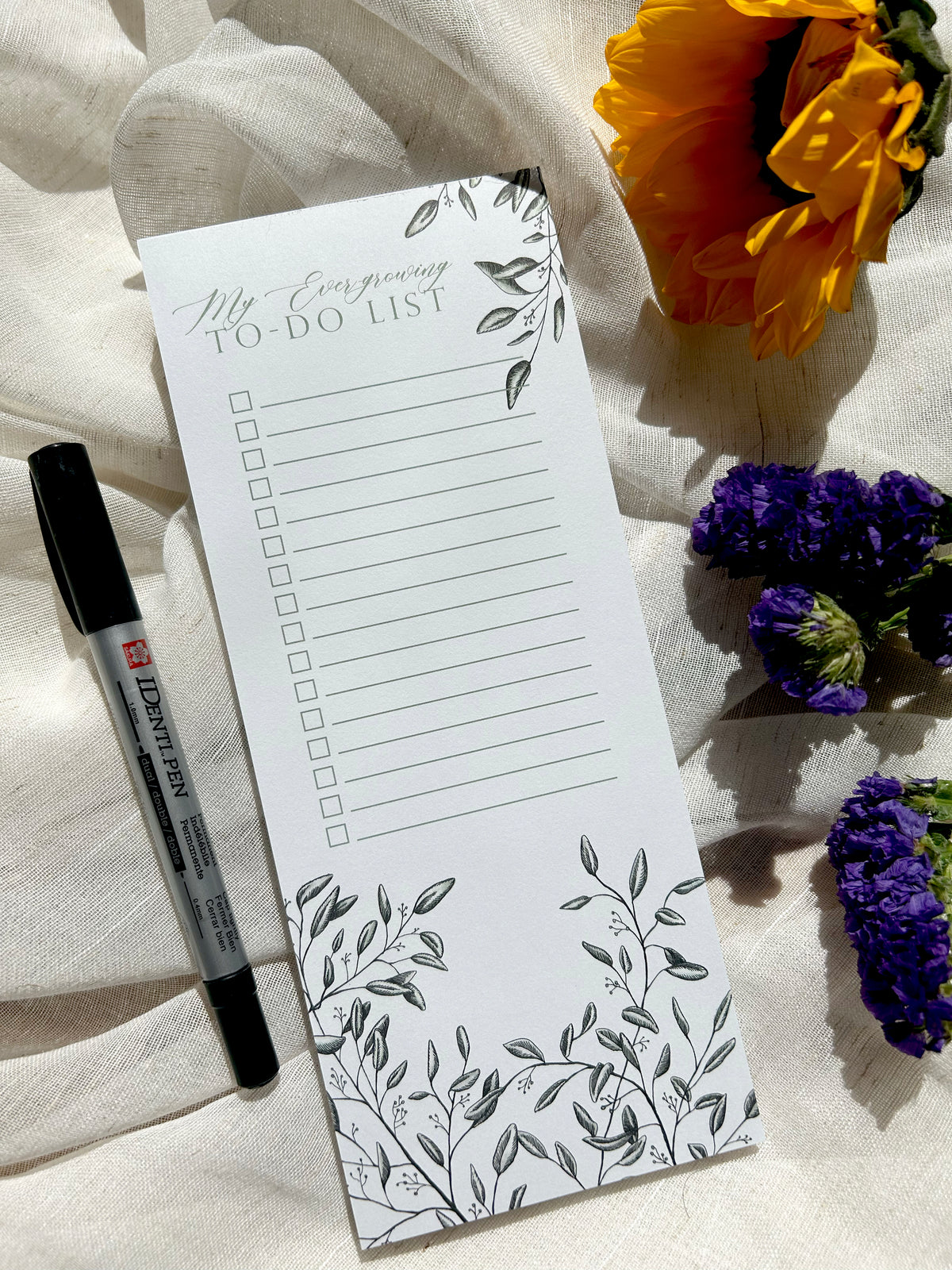 3.5 by 8.5 notepad with lined sheets with florals that says "My ever-growing to-do list" by Rust Belt Love