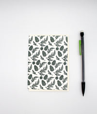 Letterpress green pinecone small card by Rust Belt Love, shown with pencil for size reference