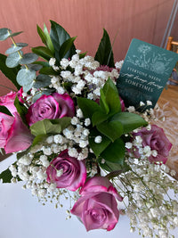 Styleshot of Rust Belt Love's green floral minicard in a bouquet of flowers