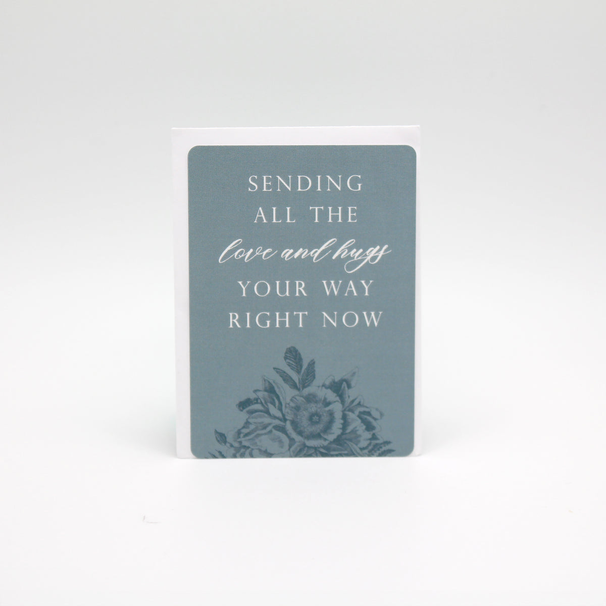 Light blue floral minicard that reads "Sending all the love and hugs your way right now" by Rust Belt Love