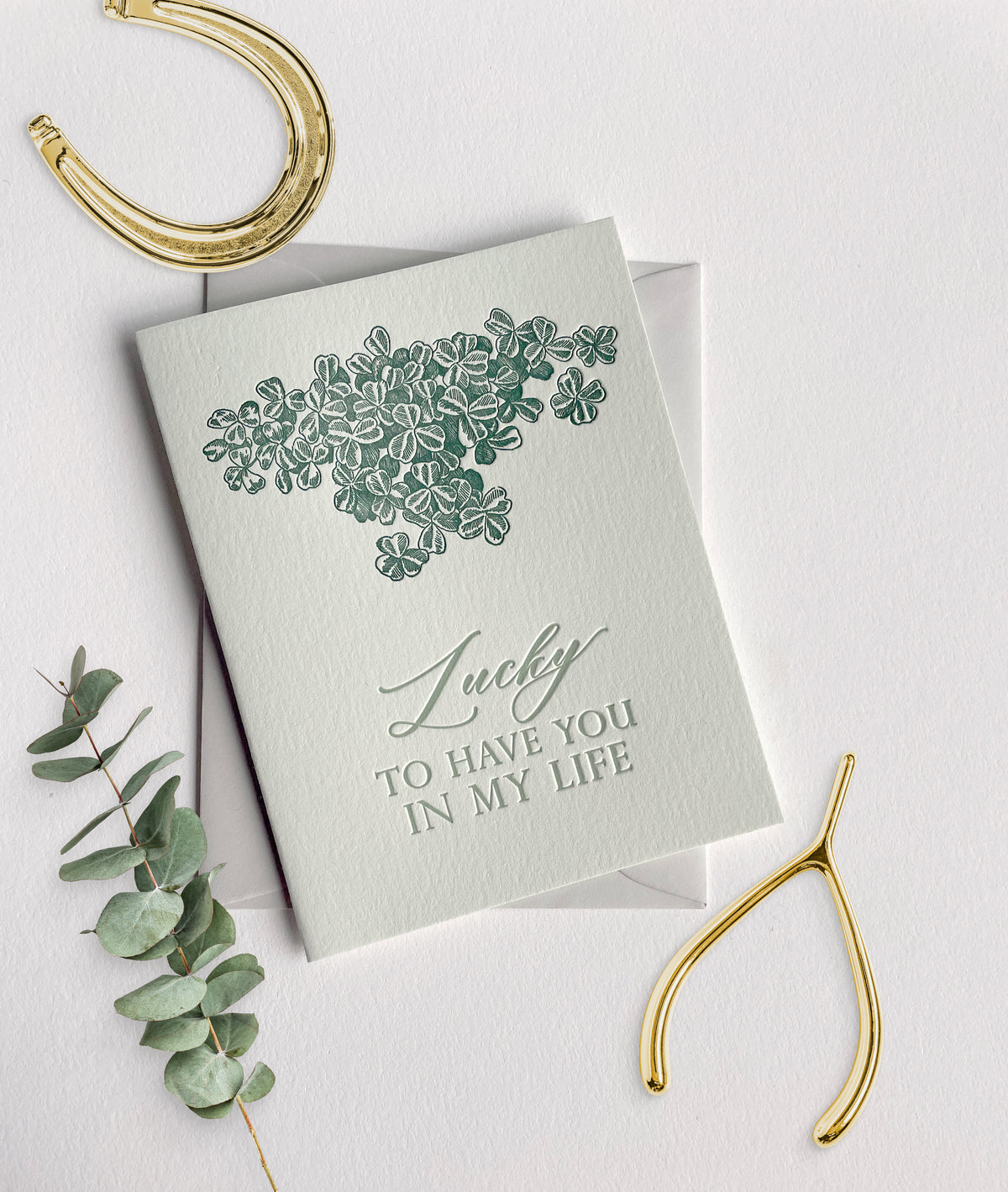 Letterpress card with shamrocks that says "Lucky to have you in my life" by Rust Belt Love