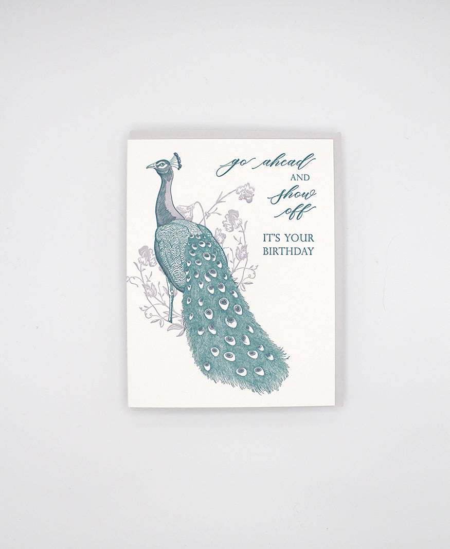 Letterpress birthday card with florals and peacock illustration that reads "Go ahead and show off it's your birthday" by Rust Belt Love