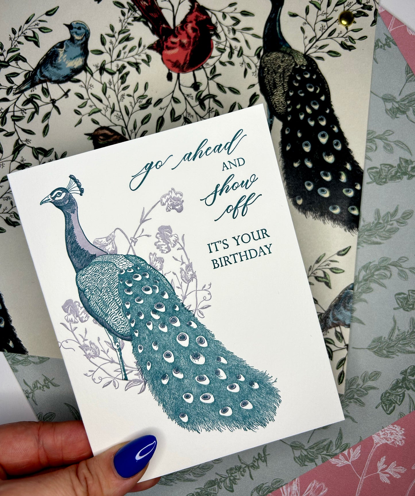Letterpress birthday card with florals and peacock illustration that reads "Go ahead and show off it's your birthday" by Rust Belt Love
