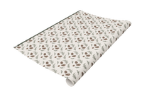 Rust Belt Love's wrapping paper with pinecones and leaves pattern on it.