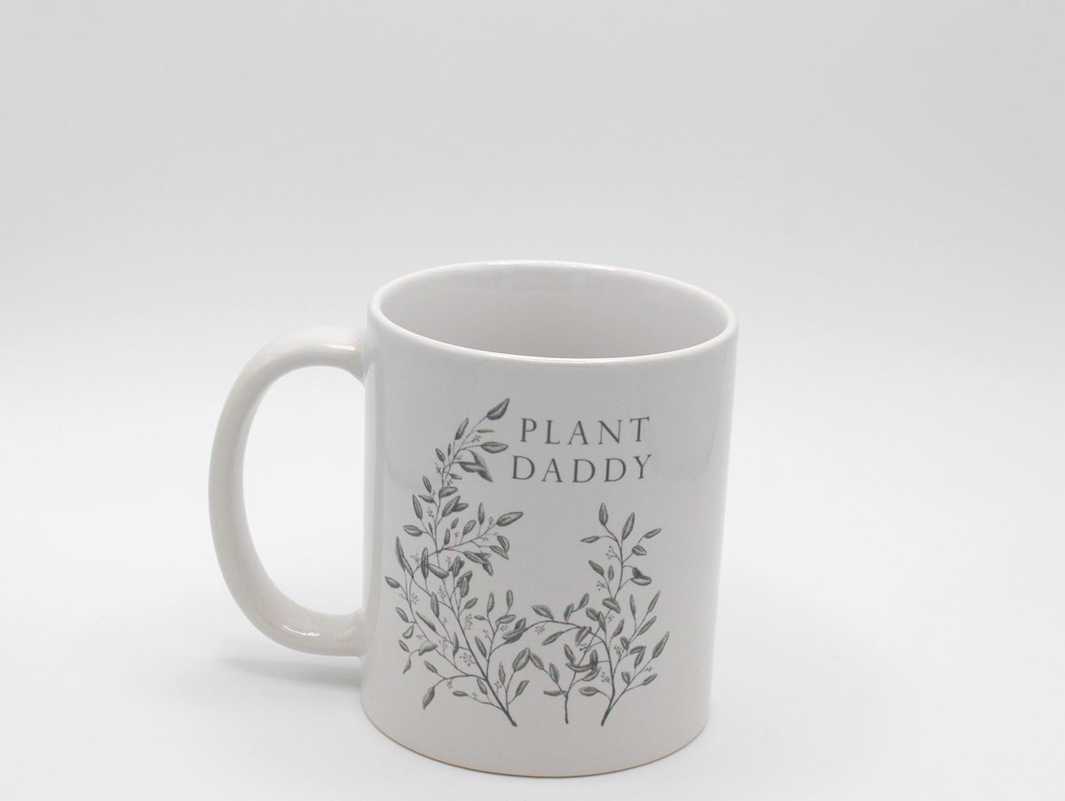 White ceramic mug with greenery that says "Plant daddy" by Rust Belt Love