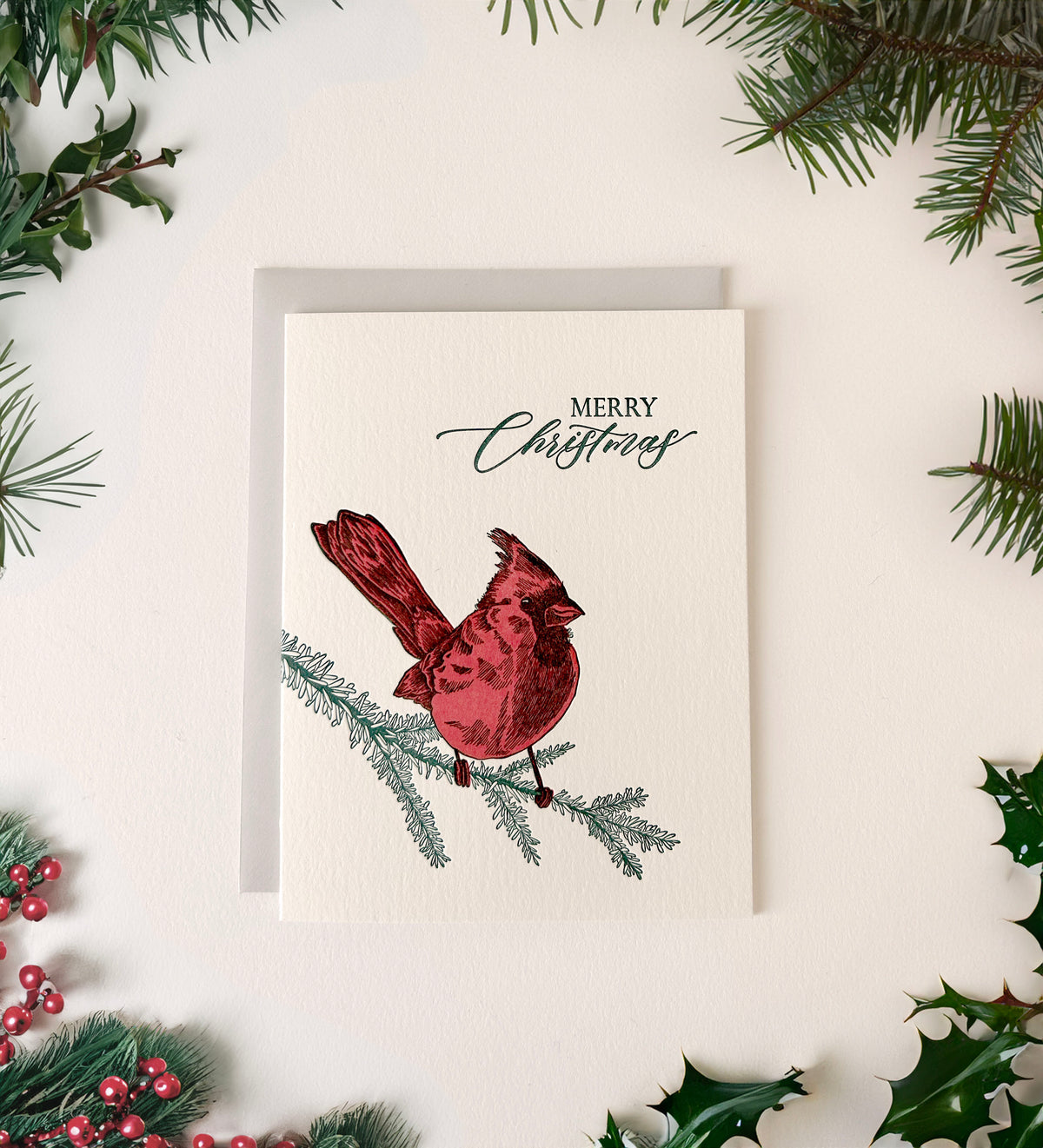 Letterpress holiday card with cardinal that says "Merry Christmas" by Rust Belt Love