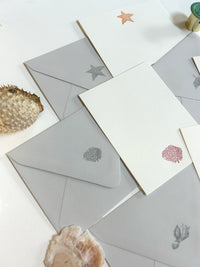 A variety of Rust Belt Love's seaside flat note card collection.