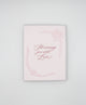 Letterpress love card with florals that says "Showering you with love" by Rust Belt Love