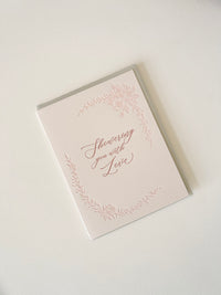 Letterpress love card with florals that says "Showering you with love" by Rust Belt Love