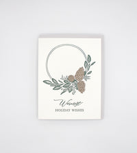 Letterpress holiday card with pinecones and greenery that says "Warmest holiday wishes" by Rust Belt Love