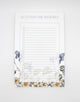 5.5 by 8.5 notepad with lined sheets with multi-colored florals that says "Let's plan this wedding!" by Rust Belt Love