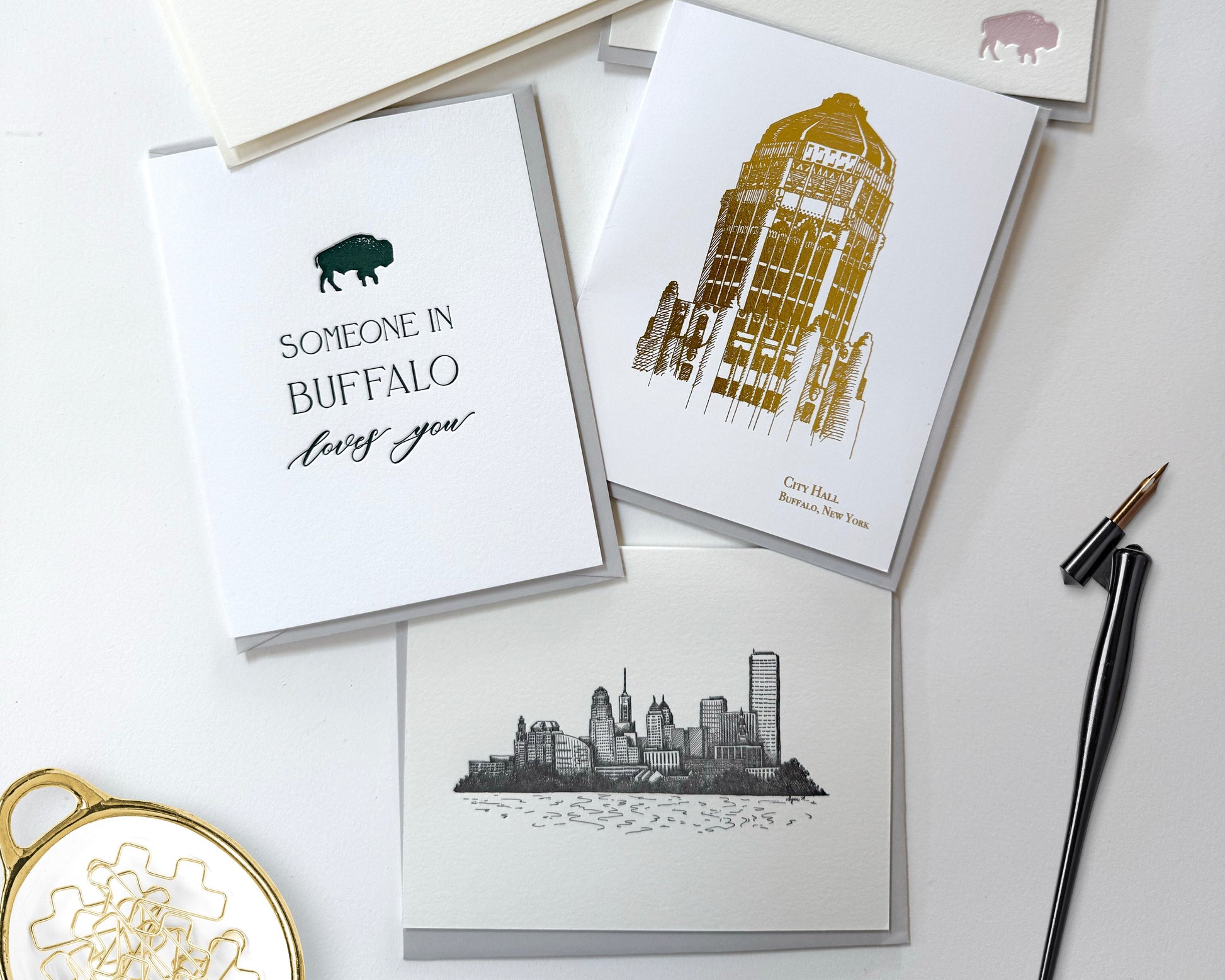 Collection of greeting cards with various designs on a white surface.