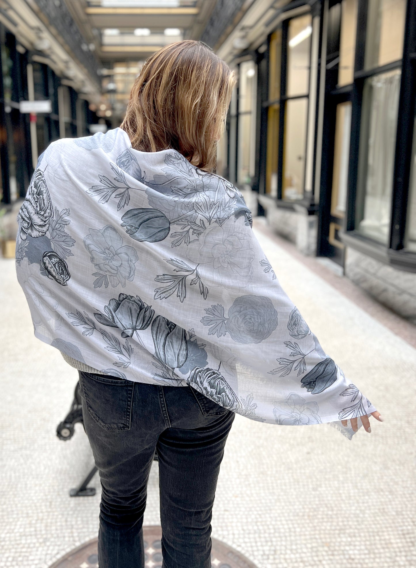Model wearing blue floral pashmina scarf by Rust Belt Love