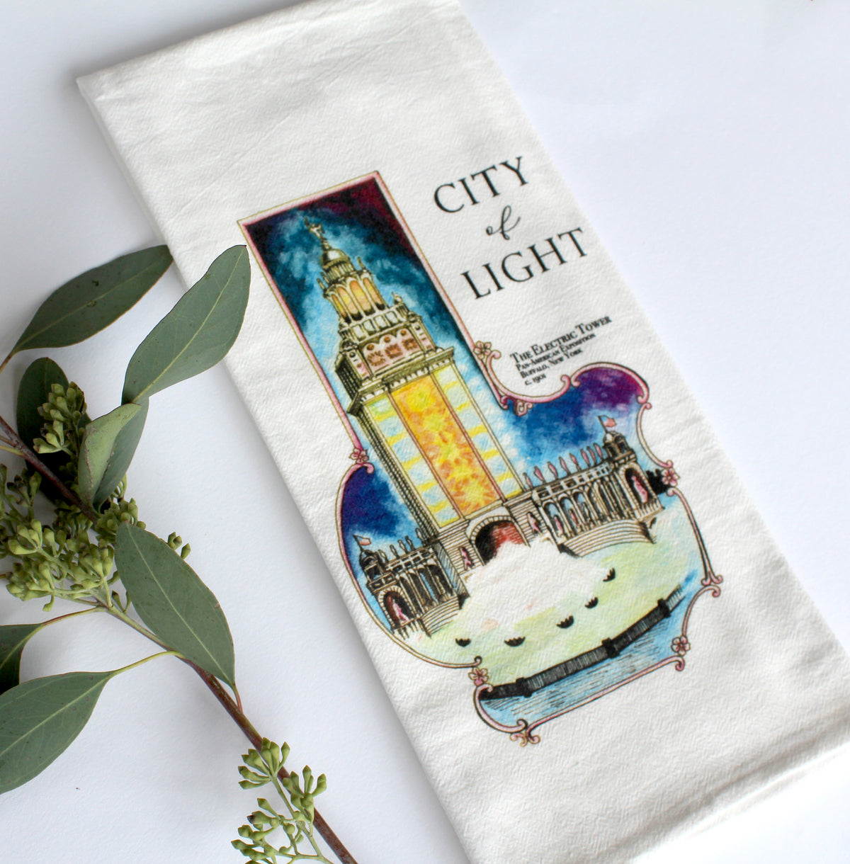 White Tea Towel with electric tower illustration that says "City of Light" by In Good Company