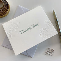 Letterpress thank you card with blind florals that says "Thank You" by In Good Company