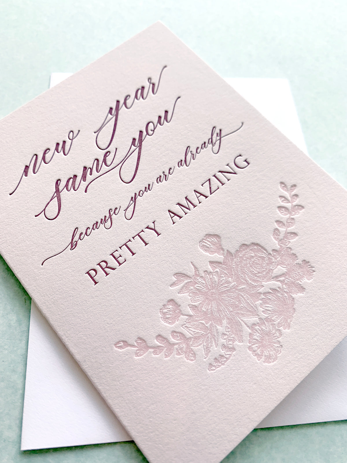 Letterpress holiday card with florals that says "New year same you because you are already pretty amazing" by In Good Company